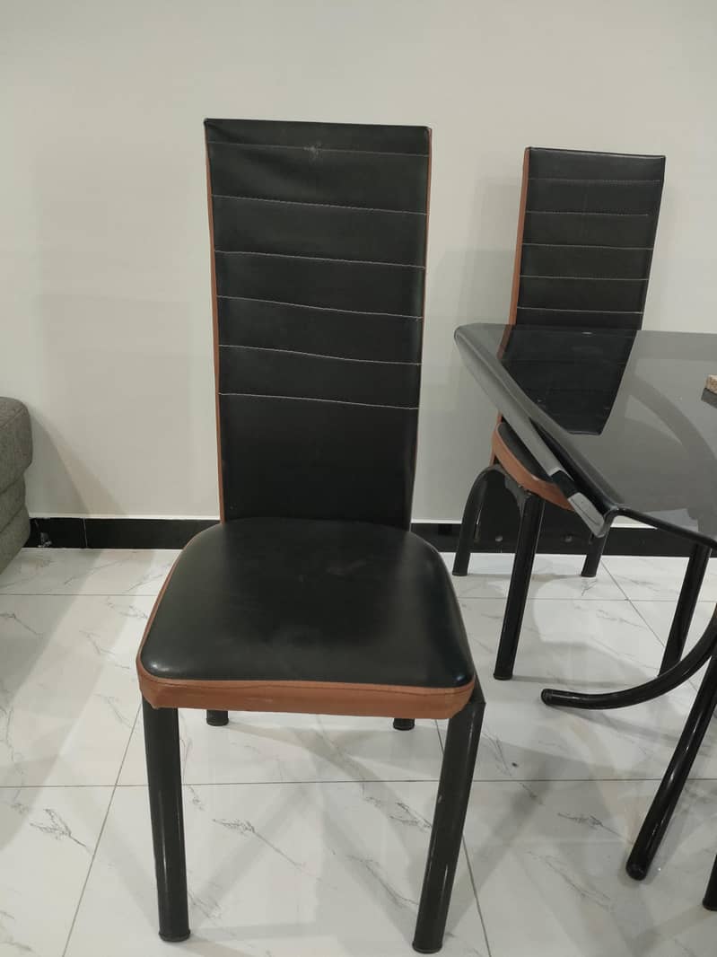 Glass dining table with solid iron base 2