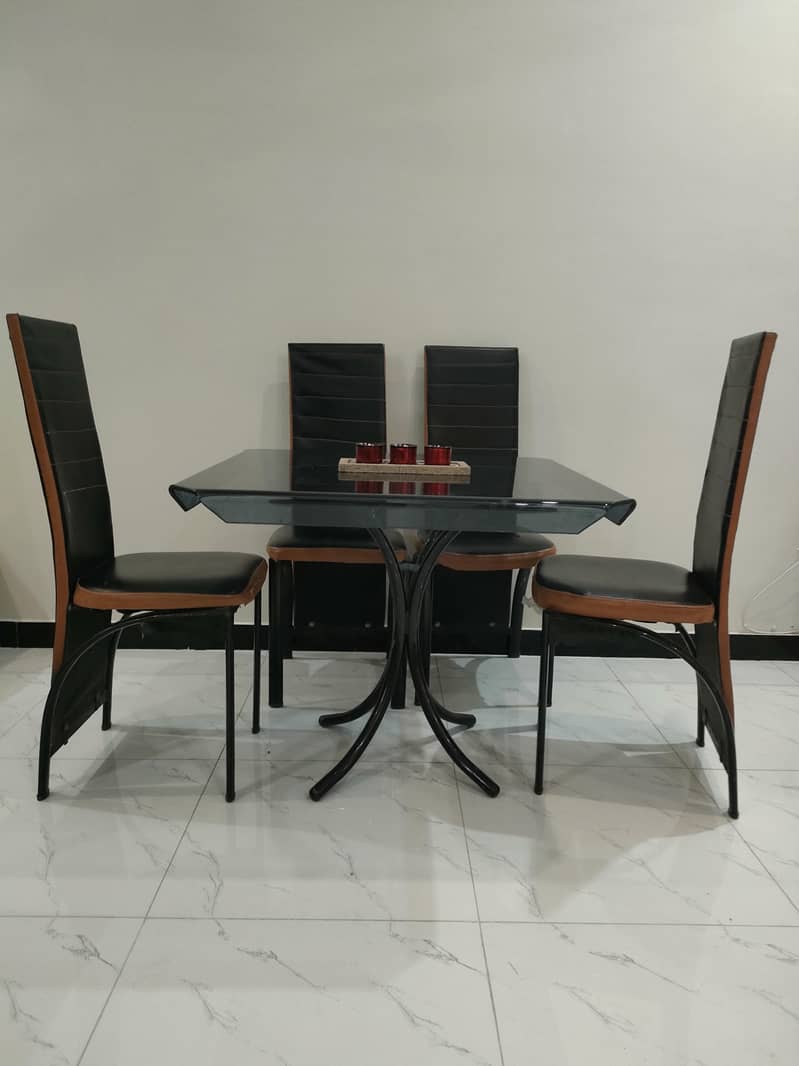 Glass dining table with solid iron base 3