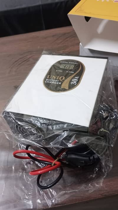 UNIQ Battery Charger Model # TM-453077, 30 A Royal Series