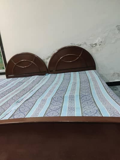 pair of single beds made of pure wood