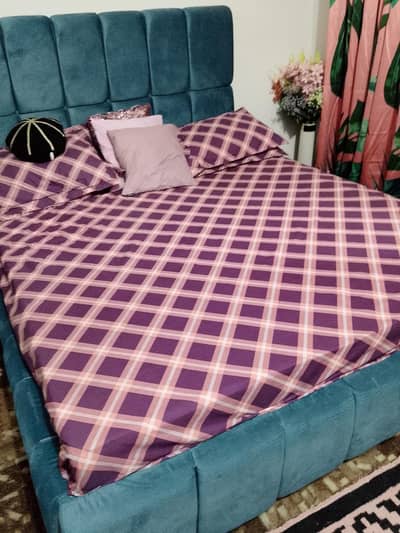 sky blue bed with sitting box