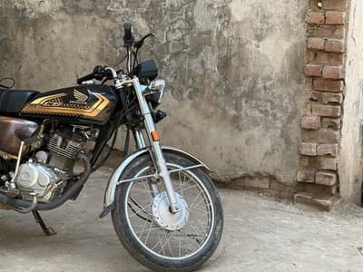 honda 125 self start golden adittion