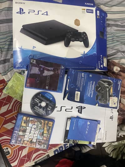 Playstation 4 slim 2 controllers  3games one sony stand/charger