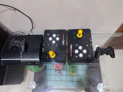 Playstation 3 with two consoles and two Arcade Stick and box.