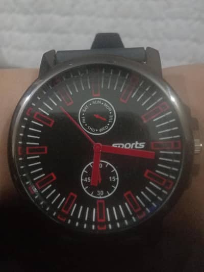 Beautiful big dial in red colour watch .