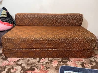 Brown sofa cum bed