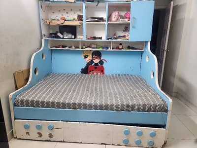 Kids bed with matching cupboard and rocking chair