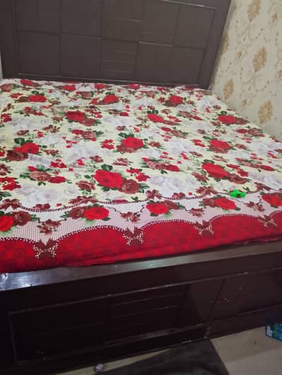 wooden bed with one side table,