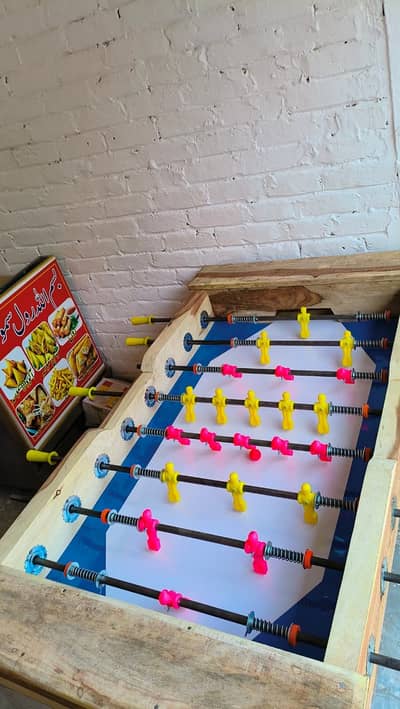 Foosball table, soccer table, bataway, table football