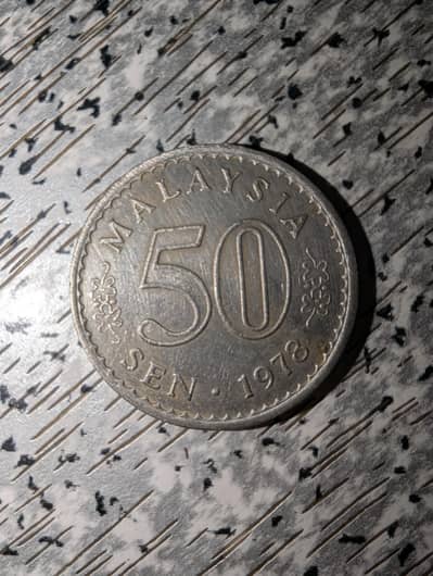 Malaysian 50 sen 48 year old coin condition is 10/10