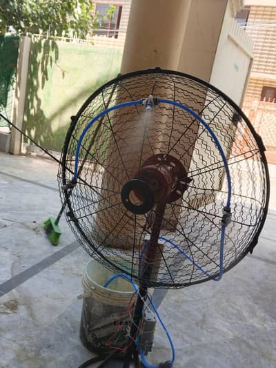 Table fan with water system