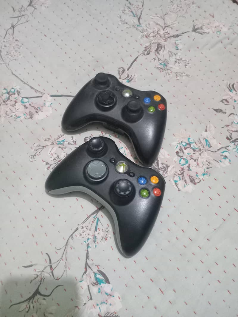 xbox 360 with two wireless controllers 2