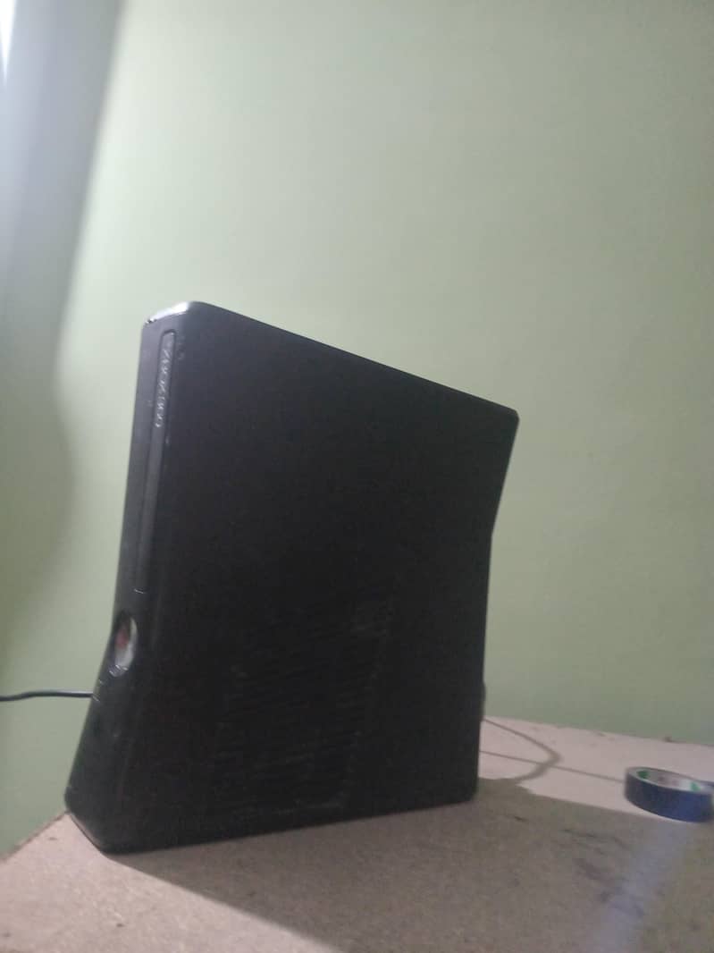 xbox 360 with two wireless controllers 3