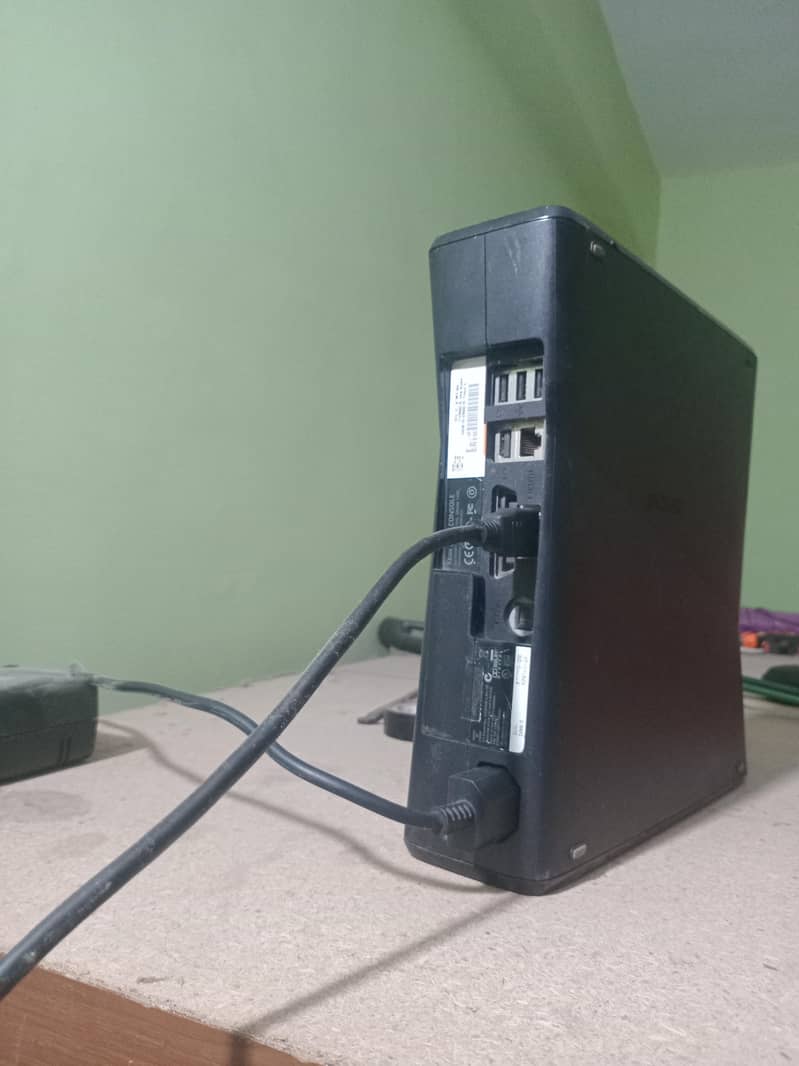 xbox 360 with two wireless controllers 4