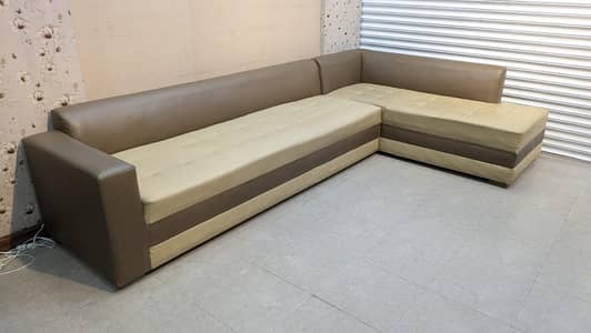 For sale: leather L shaped sofa 7-seater with Ottoman