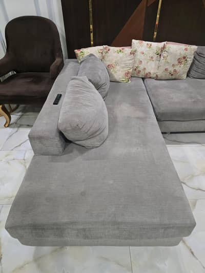good condition L shape sofa bed gray color