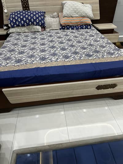 King size bed with side table