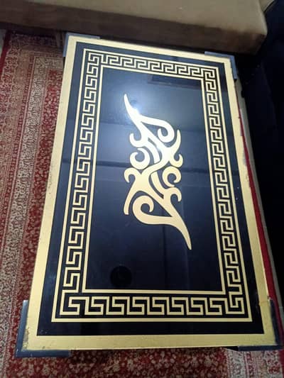 modern glass top centre table black with gold Greek key design