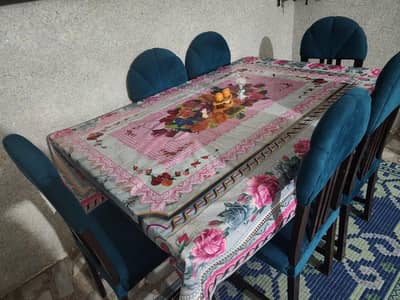 6-seater dining table set with elegant teal velvet chairs_