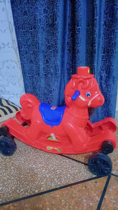 2 in one rocking horse. . . almost new. . kids not use