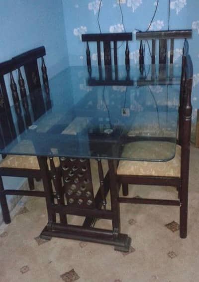 wooden and glass Dining table and six chairs are available for sale
