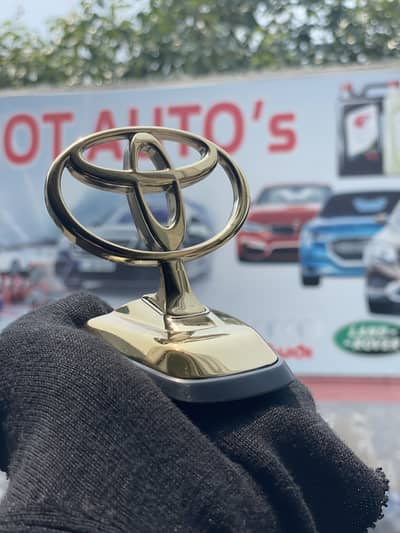 Toyota  front hood gold emblem