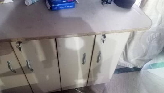 A pair of wardrobe and iron stand