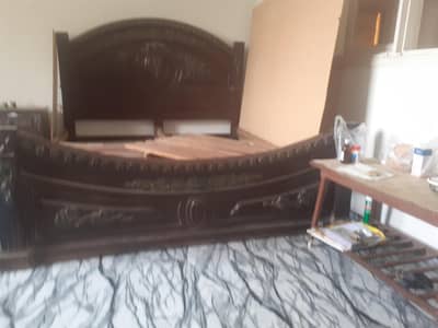 Bed with side table and dressing table
