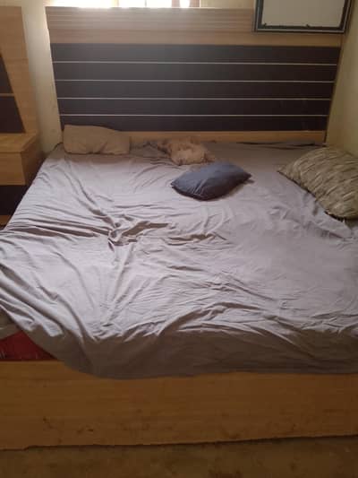 king size wooden bed with stylish headboard
