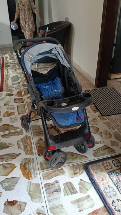 pram in blue colour