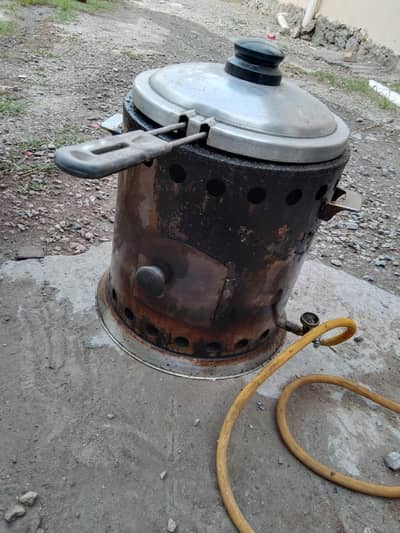 Heat stove for fryes with bucket