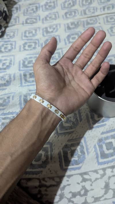These are Tiens Ti-Energy Magic White bracelets made of ceramic and  t