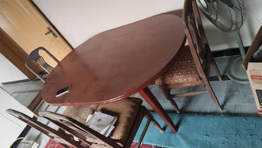 Dining table full size with 5 seater. Wood finished.