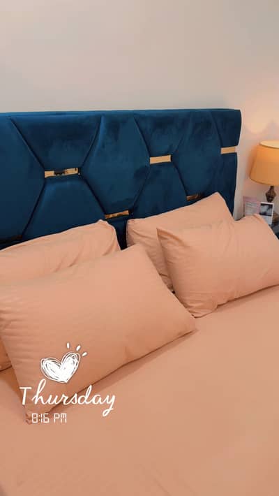 King size bed with two side tables ,2 bedroom chairs and storage