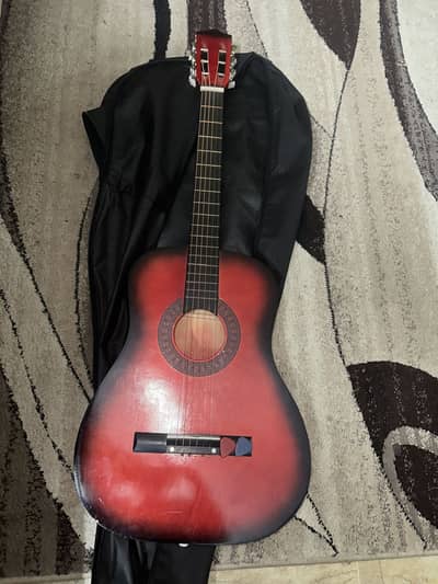 Red guitar with bag and picks