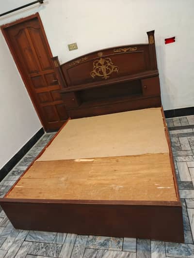 Wooden bed alongwith mattress queen size