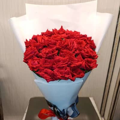 Fresh flowers bouquet and teddy bear