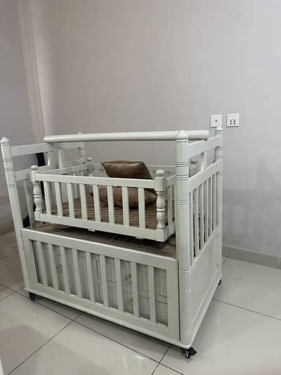 Baby wooden cot with storage spaces