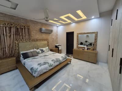 golden bed with  2 sides table and dressing table with mirror