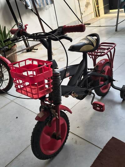 Kids cycle with basket , black ND Red clr , Excellent condition .