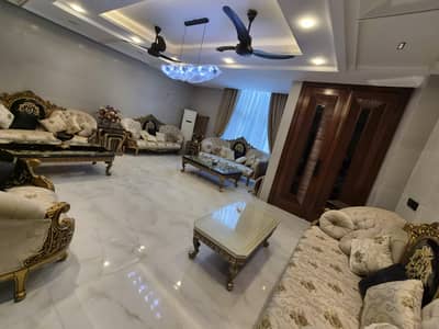 drawing room golden sofa with tables