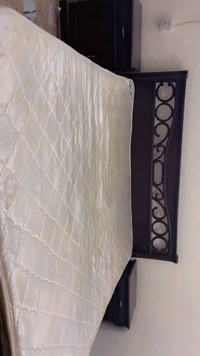 Double bed with spring mattress