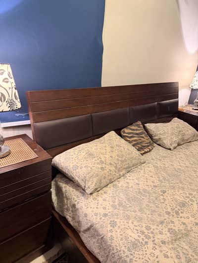 Bed with side table and mirror