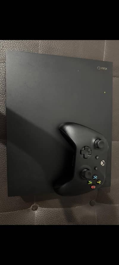 XBOX ONE X with original wireless controller and 2 cds
