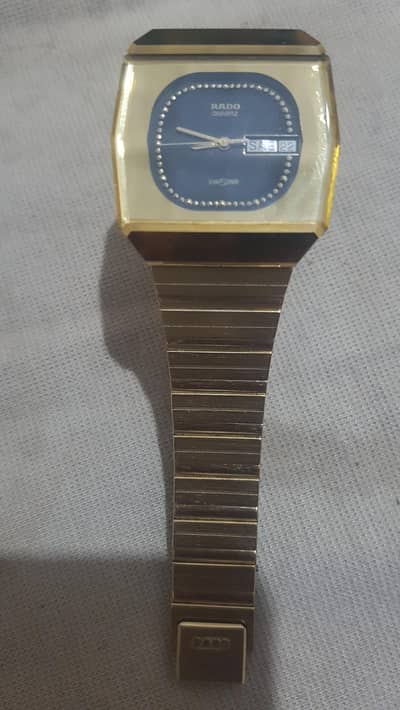 rado daistar silver jublee. 24 carat gold macrone chane safair glass