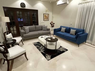Two 3-Seater Sofas + Centre Table