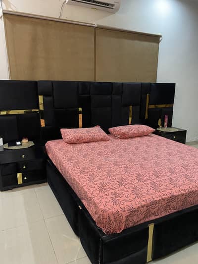 Modern customised bed with two side tables and dressing table