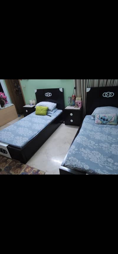 two single beds with drawers