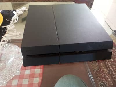 PS4 with three disc games wires box and one original controller