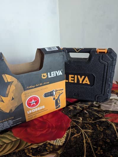 cordless drill machine 12 volt rechargeable _like new with 2 batteries